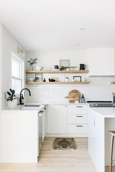 an instagramted photo of a white kitchen