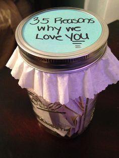 a jar filled with money sitting on top of a table