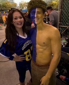 two people with painted faces posing for a photo