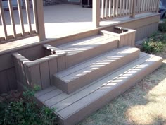 the steps are made of wood and have railings on each side, leading up to the second floor