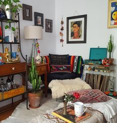 a living room filled with lots of furniture and decor