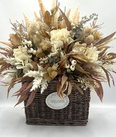 a wicker basket filled with lots of flowers