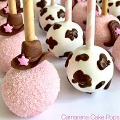 chocolate covered marshmallows with pink and brown decorations