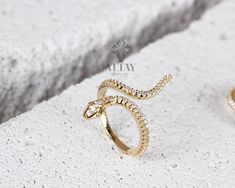 ABOUT PRODUCT This 14k Gold Snake Ring is suitable gift for girlfriend, mom and her. You can even buy as a birthday gift for your friends or anniversary gifts, If you want to add a special note we can write for you and put to inside of package. We manufacture our jewelry pieces with carefully and after production we double checking in quality control department. Our main idea is keep our items for daily wearing especially for minimalist jewelry pieces. Cute Snake animal ring. Great design tiny g Elegant Cubic Zirconia Snake Ring Gift, Luxury Sterling Silver Snake Ring Gift, Fine Jewelry Cubic Zirconia Snake Ring Gift, Hand Set White Gold Diamond Ring As Gift, Gold Snake Ring With Diamond Accents For Gift, Gold Snake Ring With Diamond Accents As Gift, Adjustable Jewelry With Pave Setting As Gift, Adjustable Pave Setting Jewelry As Gift, White Gold Snake Ring Fine Jewelry For Gift