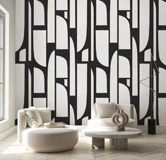 a modern living room with black and white wallpaper