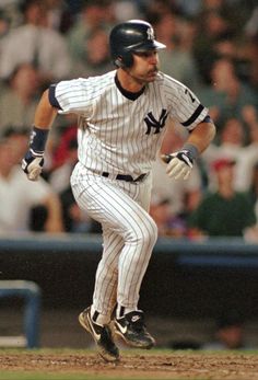 a baseball player is running on the field