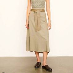 Description: Paper Bag Skirt With Leather Tie Belt, Meant To Be Secured High On The Waist. A Tiered Silhouette Adds Fullness. Size: 4 Material: 67% Wool, 33% Nylon *Color Does Vary In Picture Due To Lighting Condition: Brand New, New Worn. Elegant Khaki Skirt For Workwear, Elegant Khaki Skirt, Fall Belted Skirt For Day Out, Chic Khaki Skirt For Fall, Chic Belted Skirt For Day Out, Chic Khaki Skirt For Spring, Elegant Belted Skirt For Day Out, Casual Belted Midi Skirt, Casual Belted Flowy Skirt