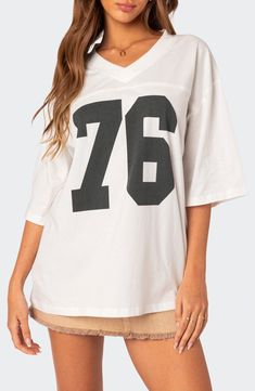 Your favorite year, your team number or your lucky number—keep 'em all guessing when you slip into the oversized jersey-inspired T-shirt made from soft cotton. V-neck Elbow-length sleeves 100% cotton Machine wash, dry flat Imported Oversized Jersey, Flannel Sweatshirt, Retro Jersey, Low Rise Jeans, Sweaters And Jeans, Oversized T Shirt, Women Trends, Top Fabric, Jersey Top