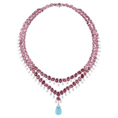 At the center of the necklace glistens a stunning Pink Tourmaline gemstone, radiating with a delicate hue that exudes femininity and grace. Surrounding the tourmaline are sparkling Diamonds, meticulously set to enhance its brilliance and allure. The Diamonds add a touch of sophistication and luxury to the piece, creating a mesmerizing contrast against the soft pink hues of the tourmaline. FOLLOW SPECTRUM JEWELS storefront to view the latest collection & exclusive pieces. Spectrum Jewels is proud Pink Blue Diamond Necklace, Luxury Pink Tilla Necklace, Pink Diamond Necklace 1stdibs, Luxury Pink Gold Gemstone Necklaces, Luxury Silver Tourmaline Necklaces, Luxury Pink Sapphire Gemstone Necklace, Diamond Statement Necklace, Pink Tourmaline Necklace Gold, Blue Diamond Necklace