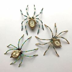 three spider clocks sitting next to each other