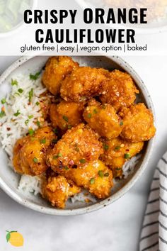 crispy orange cauliflower served in a bowl with rice and garnish