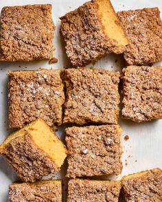 An overhead view of sliced crumb cake on parchment paper Cake Flour Substitute, School Cake, Waffle Cookies, Lunch Appetizers, Light Cakes, Sweet Buns, Food History, Crumb Cake