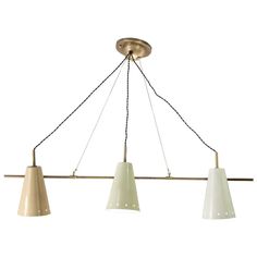 three lights hanging from a ceiling fixture