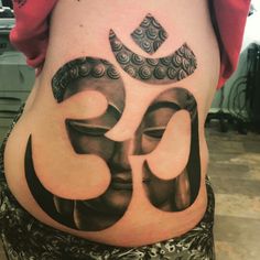 the back of a woman's stomach with an ombrephant tattoo on it