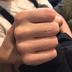 a close up of a person's hand holding something