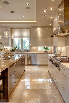 a large kitchen with marble counter tops and stainless steel appliances