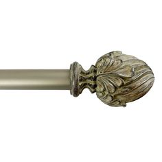 a metal curtain rod with an ornate design on it's end and a leafy finial