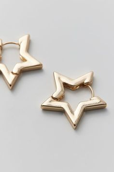 Chunky hoop earrings in a star silhouette that's out-of-this-world. Complete with a latch closure. Content + Care Mixed metal Avoid contact with water Imported Size Dimensions: 1" w | Star Hoop Earring in Gold, Women's at Urban Outfitters Every Jewels Earrings, Star Earrings Gold, Trendy Star-shaped Nickel-free Hoop Earrings, Hoop Jewelry With Star Charm In Metal, Star Charm Hoop Earrings For Party, Star-shaped Hoop Earrings With Star Charm For Party, Trendy Metal Hoop Earrings With Star Charm, Hypoallergenic Star-shaped Metal Hoop Earrings, Gold Star-shaped Metal Hoop Earrings