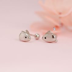 Add a touch of cuteness to your outfit with these sterling silver rabbit bunny screw back stud earrings from The Silver Luna. Made with 925 sterling silver, these earrings are durable and long-lasting. The screw back closure ensures that they stay securely in place while you wear them. Perfect for both casual and formal occasions, these earrings feature a unique anime-inspired bunny design that adds a playful touch to your look. The stud style is classic and timeless, making them a great addition to any jewelry collection. Get ready to show off your whimsical side with these adorable bunny earrings. Sold as a pair Materials: 925 sterling silver Finnish: platinum plate, enamel Dimensions: 0.26 x 0.22 in Gauge: 22 (0.7 mm) Bunny Earrings, Stud Style, Bunny Designs, Anime Inspired, Fine Jewellery Earrings, Cute Bunny, Jewelry Watches, Platinum, Jewelry Collection