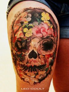 a person with a skull and flowers on their arm is shown in this instagramtion