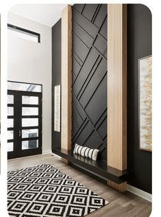 a black and white room with wood accents on the walls, rugs and artwork