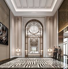 two men are standing in the lobby of an elegant building with marble floors and walls