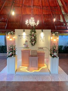 a wedding ceremony setup with flowers and candles