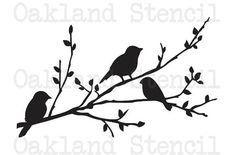 two birds sitting on the branch of a tree with leaves and branches silhouetted against a white background