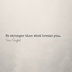 a white wall with a quote on it that says, be stronger than what breaks you