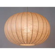 a light that is hanging from the ceiling with a circular design on it's side