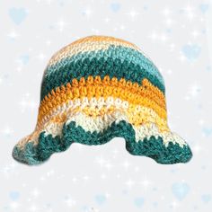 * handmade with acrylic yarn 🧶✨ * made with blue, yellow, and orange colors  and features a wavy brim 💘 * adult sized - measures about 23 inches in circumference Yellow Crochet Beach Hat, Yellow Knitted Beach Hat, Yellow Yarn Crochet Beanie Hat, Yellow Yarn Crochet Hat, Hand Knitted Yellow Crochet Hat, Yellow Yarn Beach Hat, Yellow Crochet Hat For The Beach, Yellow Crochet Cap Hat, Yellow Crochet Yarn Cap