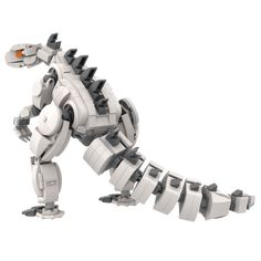 a lego dinosaur is standing on its hind legs