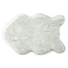 a white sheepskin rug on a white background