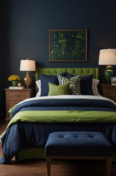 a bedroom with blue walls, green bedding and two lamps on either side of the bed