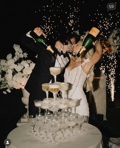 the newly married couple are celebrating with champagne