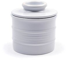 a white canister with a lid on it