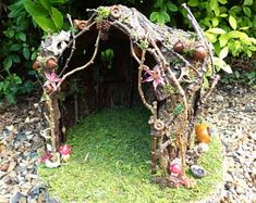 a fairy house made out of tree branches