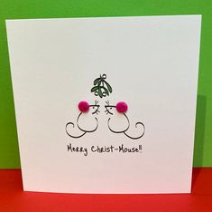 a greeting card with two cats on top of each other and the words merry christ - mouse