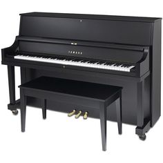 a black piano sitting on top of a wooden table next to a bench with two legs