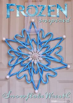 a frozen snowflake hanging from the side of a door