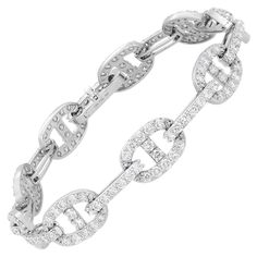 Introducing our exquisite 4.90 Carat Diamond Chain Link Bracelet in 18K White Gold. This bracelet is a true testament to luxury and sophistication. Featuring oval links encrusted with a magnificent 4.90 carats of diamond pave, it radiates brilliance and captivates attention. The chain link construction not only adds an elegant touch but also ensures extreme comfort, allowing the bracelet to drape effortlessly on your arm. Whether you want to make a bold statement or prefer a more subtle look, th Modern Bracelets, American Modern, Diamond Chain, Look Plus, Chain Link Bracelet, Bracelet Necklace, Modern Jewelry, Pave Diamonds, Diamond White