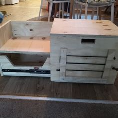 a wooden cabinet sitting on top of a hard wood floor