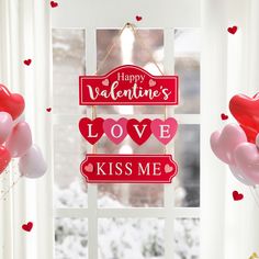 two valentine's day signs hanging on a window sill with balloons in the air