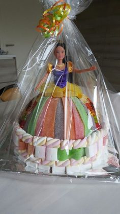 there is a cake in the shape of a princess