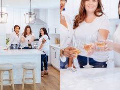 four women toasting wine glasses in the kitchen and on the counter with their friends