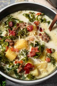 a bowl filled with broccoli, cheese and meat