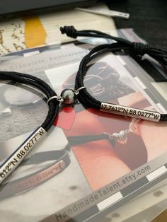 a couple of bracelets sitting on top of a book