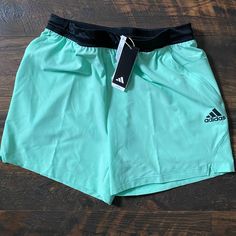 Elevate Your Gym Wardrobe With These Adidas Axis Woven 6 Inch Training Shorts In Size L. The Easy Green Color And Solid Pattern Make Them A Versatile Addition To Your Activewear Collection. The Drawstring Closure Ensures A Comfortable Fit, While The Elastic Waist And Quick-Dry, Moisture-Wicking, And Breathable Features Keep You Cool During Your Workouts. The Knit Fabric Is 100% Polyester And Machine Washable For Easy Care. The Shorts Have Pockets For Storing Your Essentials While You Train. Suit Adidas Casual Athletic Shorts With Go-dry Technology, Adidas Casual Athletic Shorts With Go-dry, Adidas Green Sportswear Bottoms, Adidas Running Shorts For Summer, Adidas Casual Shorts For Training, Adidas Casual Training Shorts, Green Adidas Sporty Activewear, Adidas Green Workout Activewear, Green Adidas Workout Activewear