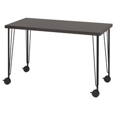 a black table with hairpin legs and a gray top is shown in front of a white background