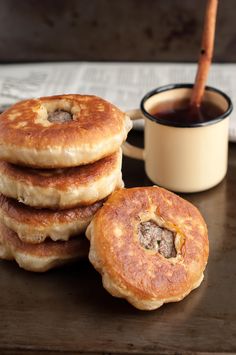 some pancakes and a cup of coffee on a table